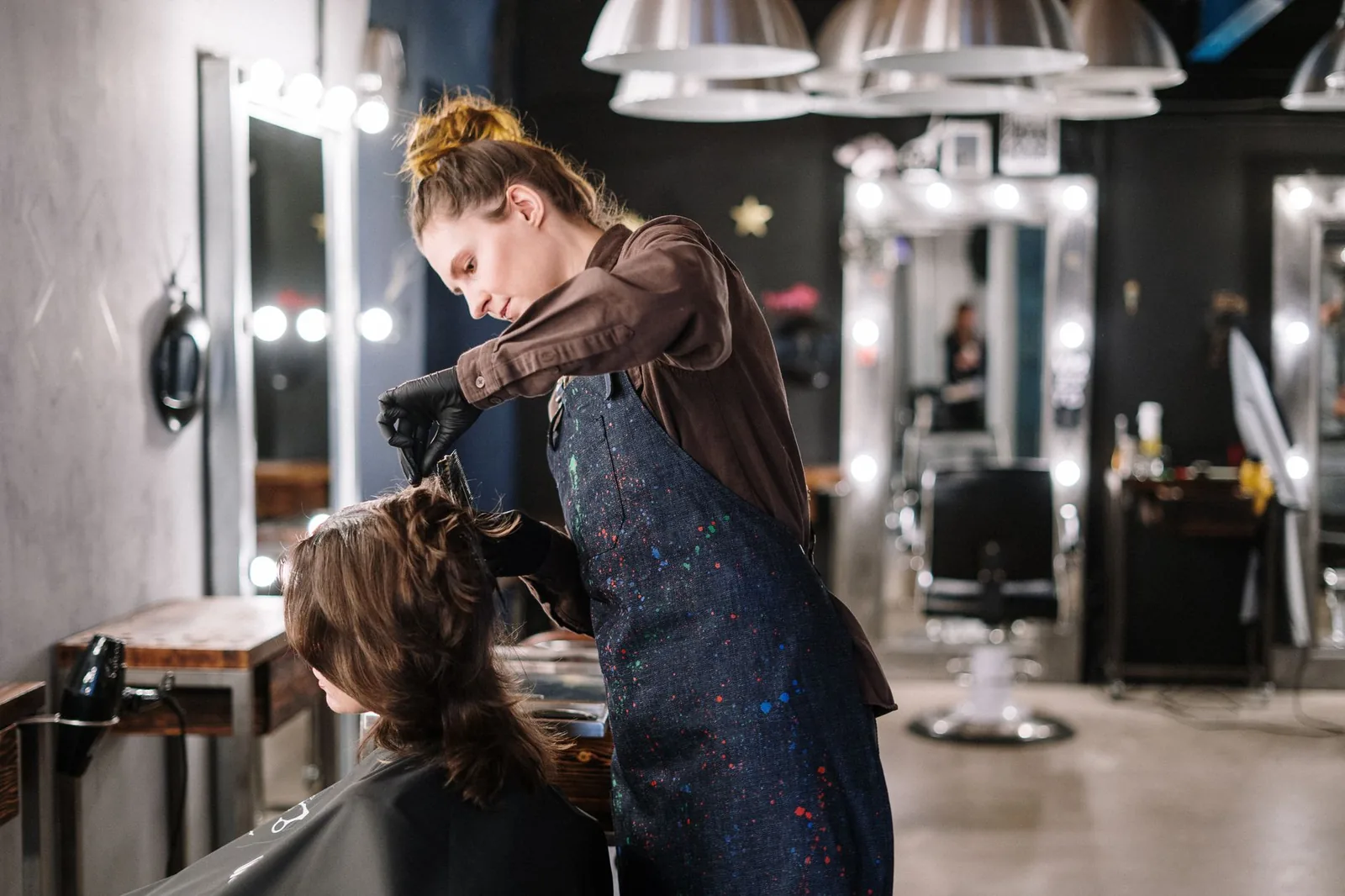 Happy client at hair salon showing successful client retention strategies in beauty industry